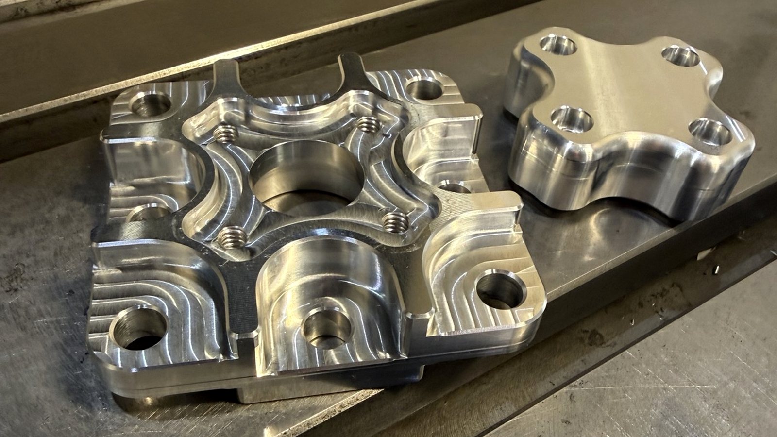 Precision CNC-machined aluminum components produced by NG Manufacturing